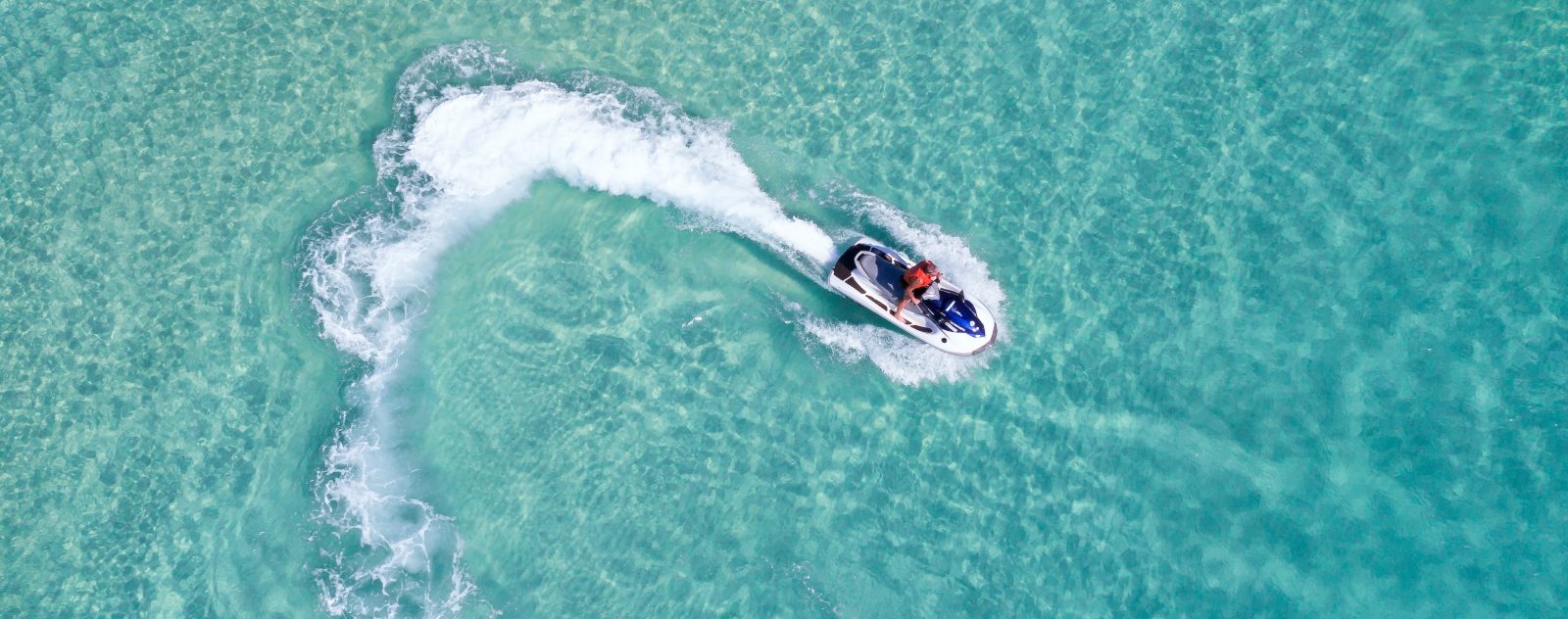 Aerial view of someone on a jet ski.