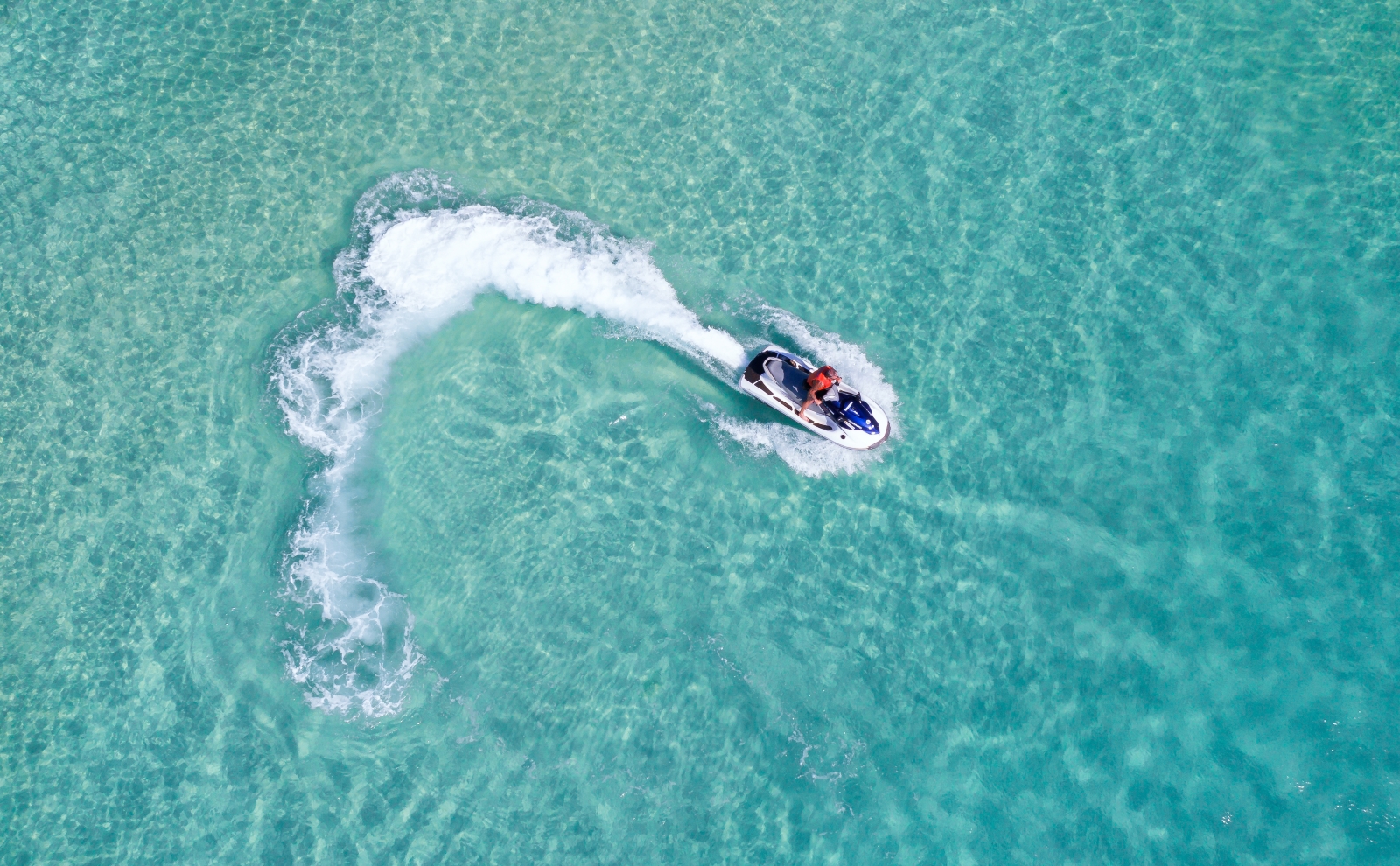 Aerial view of someone on a jet ski.
