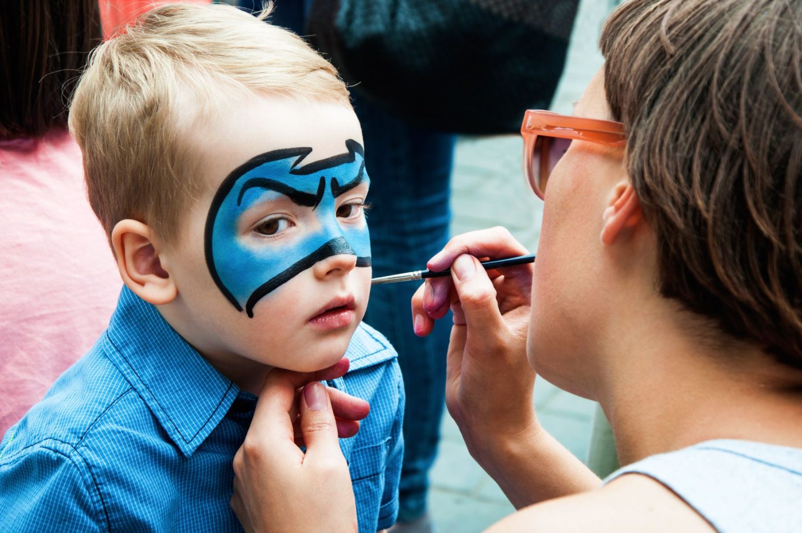 Child getting their face painted