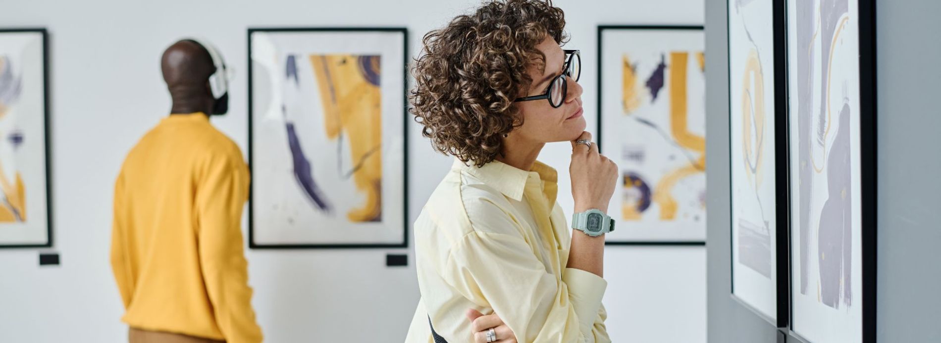 Man and woman looking at art in a museum